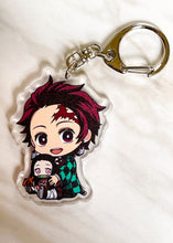 Load image into Gallery viewer, Tanjiro Holding Nezuko Keychain
